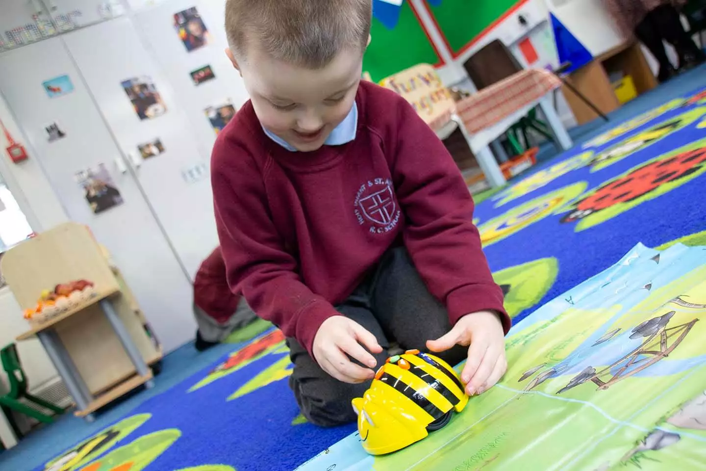 Boy playing with robot